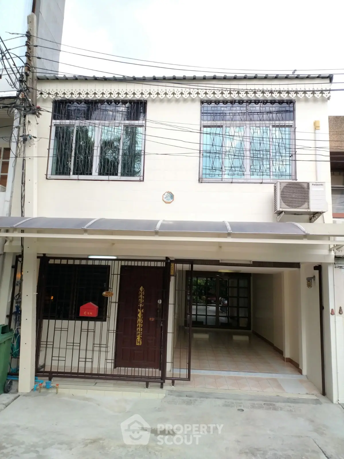 Charming two-story townhouse with gated entrance and spacious driveway