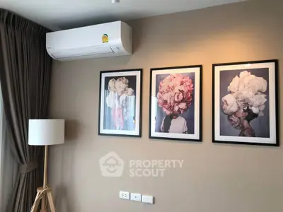 Stylish living room with modern air conditioning and elegant floral artwork