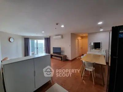 Spacious modern living room with dining area and city view