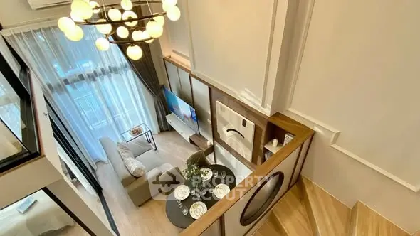 Modern duplex living room with stylish decor and large windows
