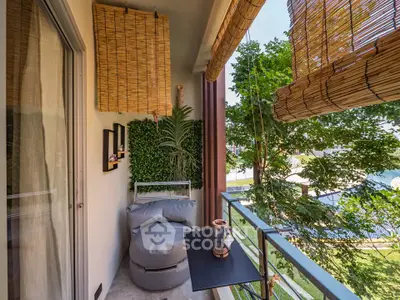 Charming balcony with cozy seating and lush greenery, perfect for relaxation and enjoying the view.