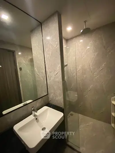 Modern bathroom with sleek design and glass shower enclosure