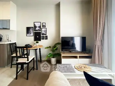 Modern living room with stylish decor and natural light, featuring a cozy dining area and sleek TV setup.