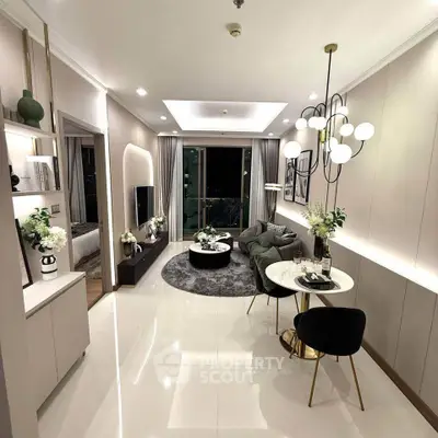 Luxurious modern living room with elegant decor and open layout, featuring stylish lighting and a cozy seating area.