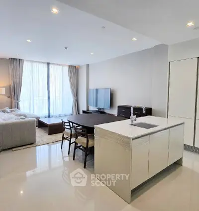 Spacious modern living room with open kitchen and large windows