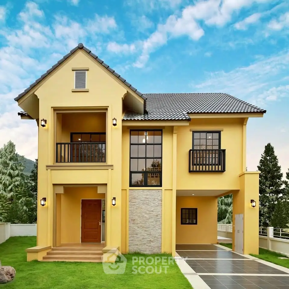 Charming two-story yellow house with modern design and lush green lawn.