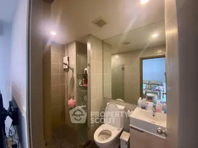 Modern bathroom with glass shower and sleek fixtures