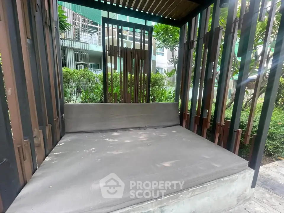 Modern outdoor seating area in a lush garden setting, perfect for relaxation and leisure.