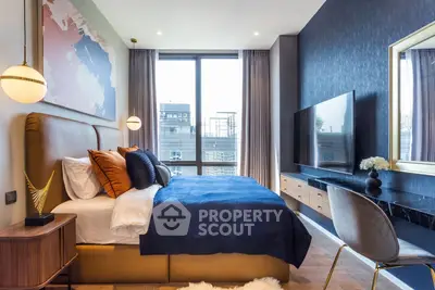 Luxurious modern bedroom with large window and stylish decor