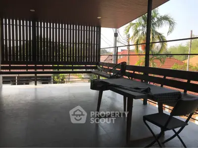 Spacious balcony with modern design and scenic view, perfect for relaxation and entertainment.