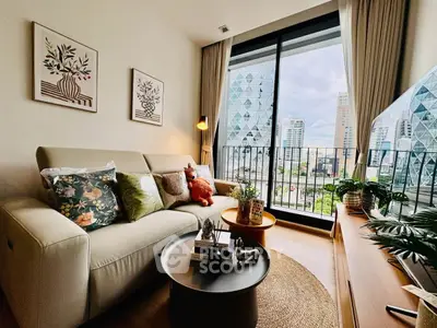Stylish living room with modern decor and city view from large window.