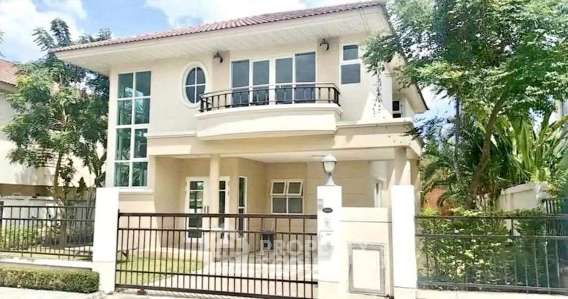 Elegant two-story house with modern design and spacious balcony in a serene neighborhood.
