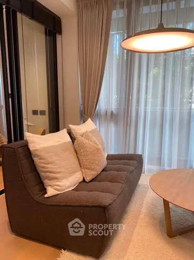 Cozy living room with modern sofa and elegant lighting