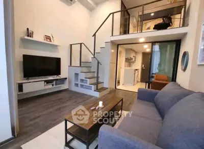Modern loft apartment with stylish living room and open kitchen layout