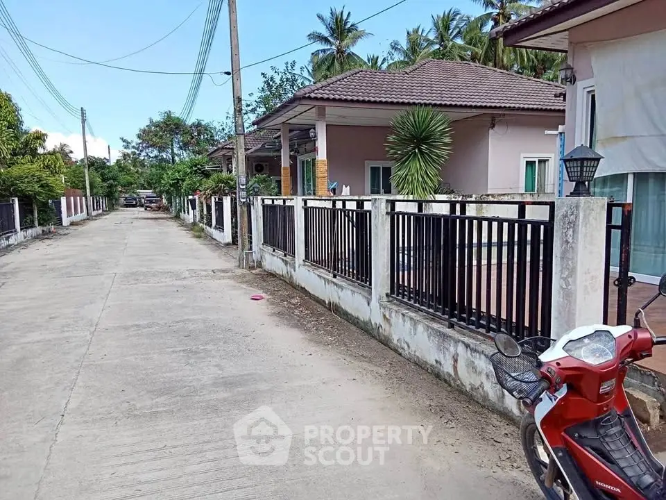 Charming suburban street with modern homes and lush greenery, ideal for peaceful living.