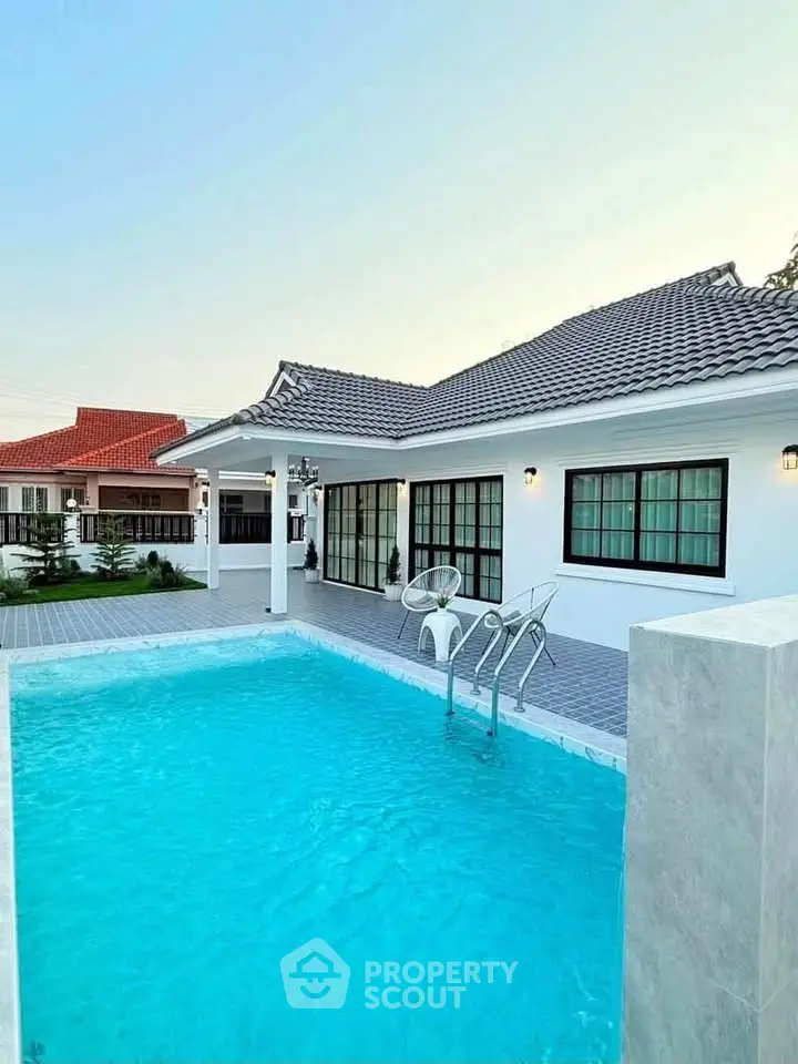 Charming single-story home with inviting pool and spacious patio, perfect for relaxation and entertaining.