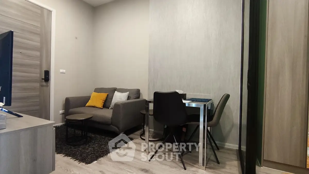 Modern living room with cozy sofa and dining area in stylish apartment