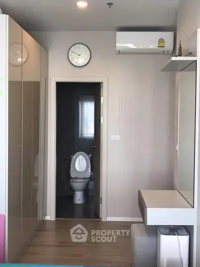 Modern apartment interior with bathroom view and sleek furnishings