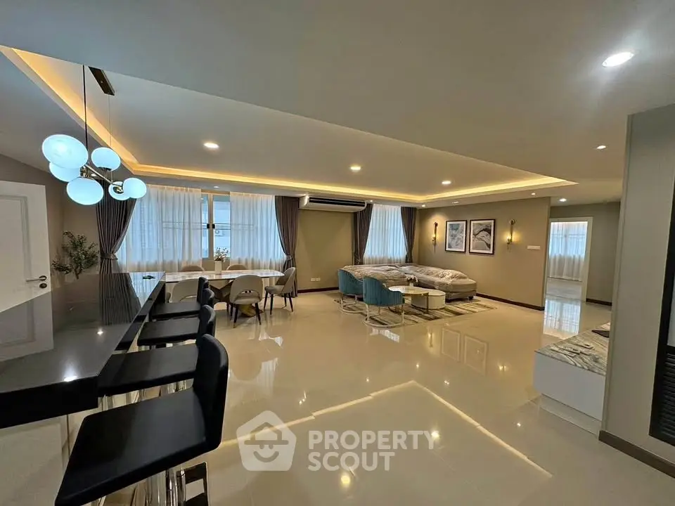 Spacious modern living room with elegant lighting and stylish furniture