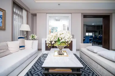Luxurious living room with elegant decor and modern furniture, featuring a stylish coffee table and plush sofas.