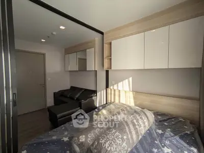 Cozy bedroom with modern decor and ample natural light