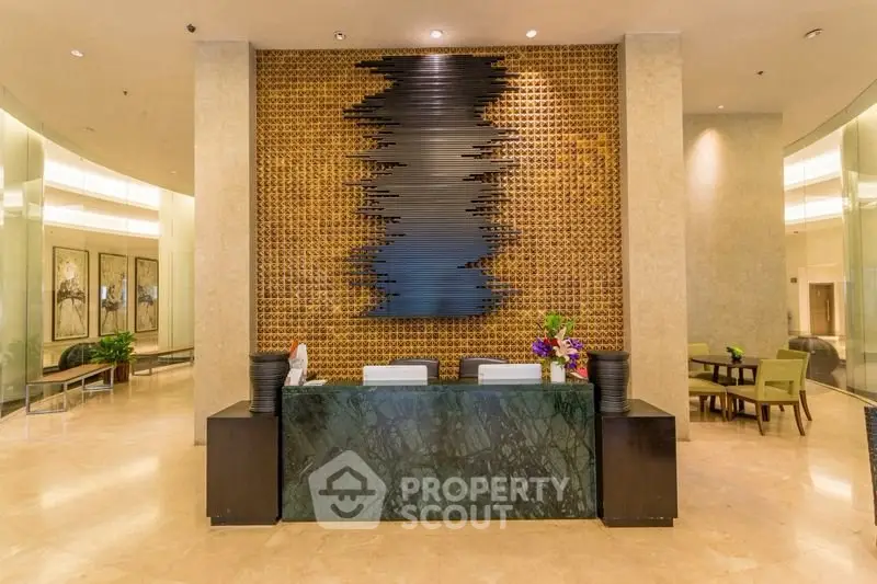 Luxurious lobby with modern decor and elegant seating area in upscale building.