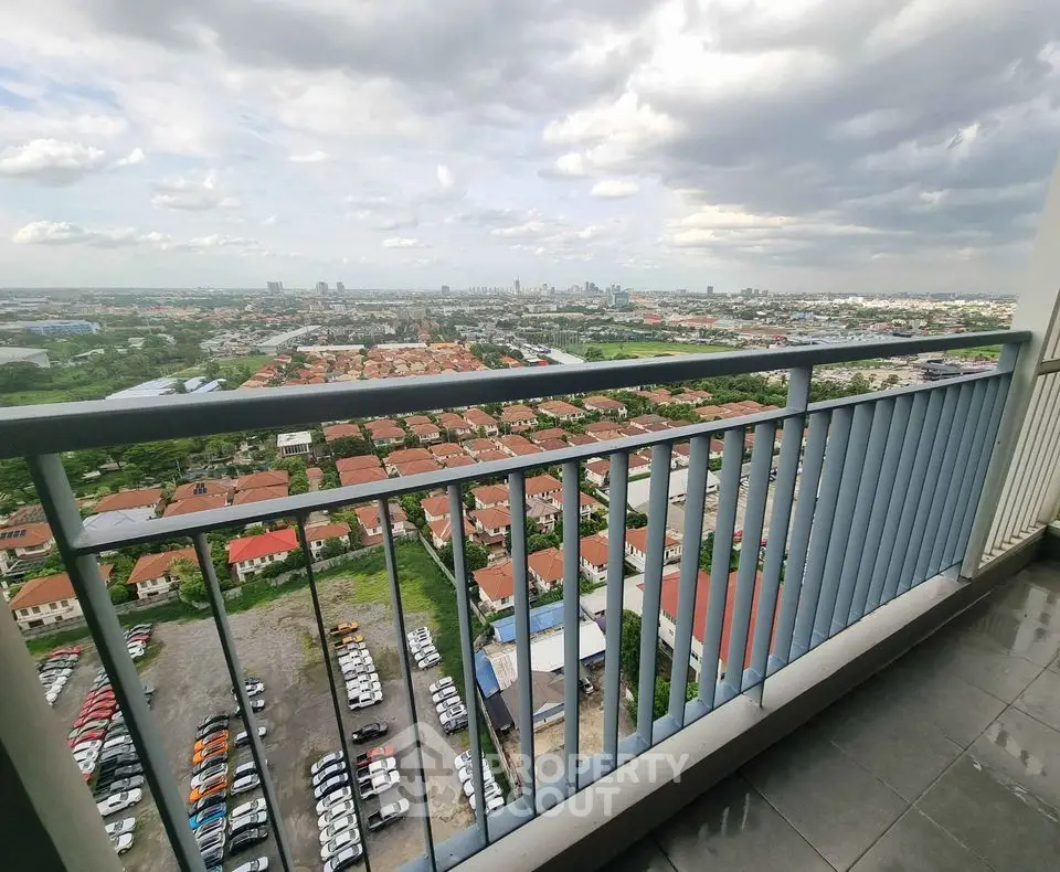 Stunning high-rise balcony view overlooking cityscape and residential area
