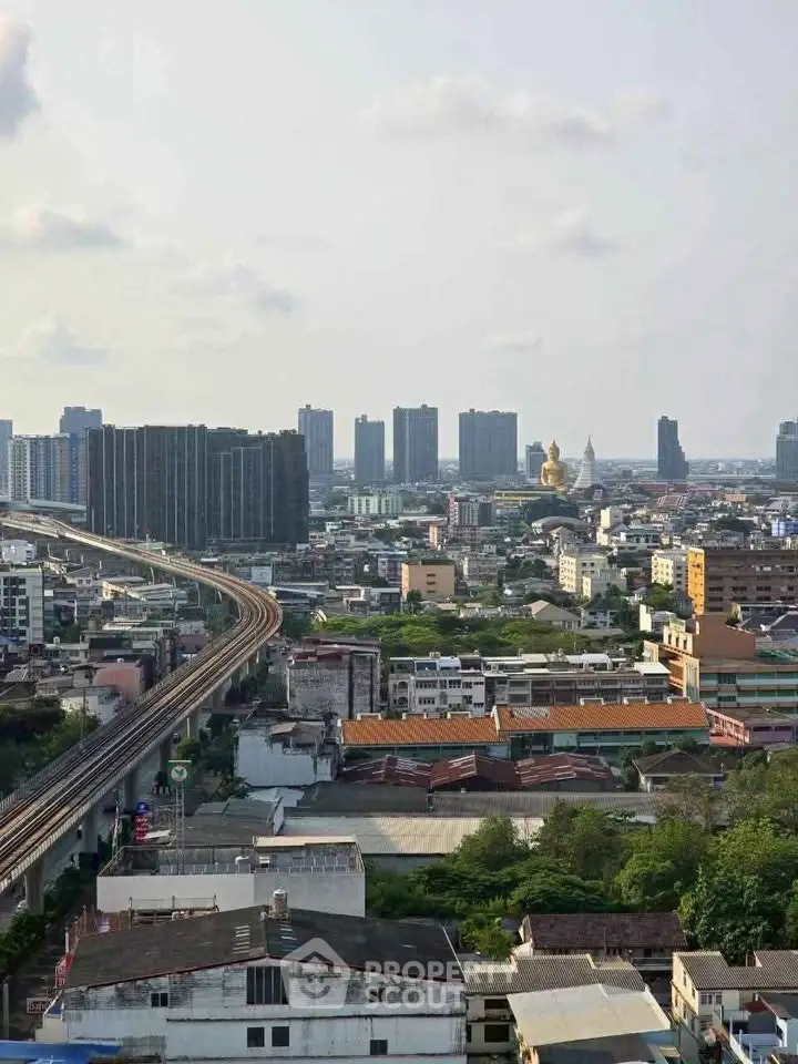 Stunning cityscape view showcasing urban skyline and residential buildings with lush greenery.