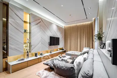 Luxurious modern living room with elegant decor and plush seating in a stylish apartment.