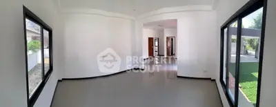 Spacious empty room with large windows and glossy floors, perfect for customization.