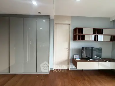 Modern living room with sleek storage and mounted TV unit