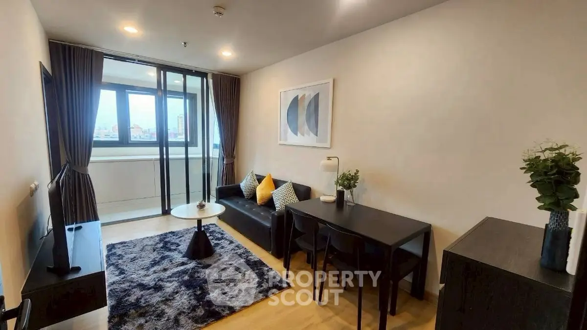 Modern living room with stylish decor and large window view