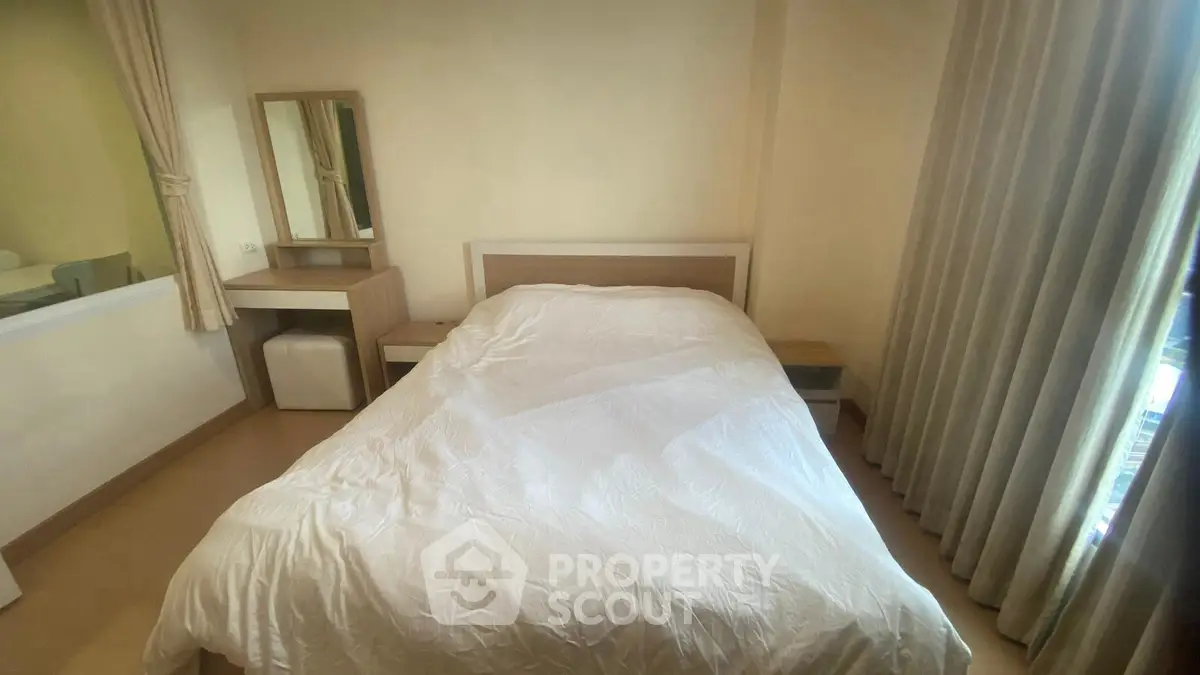 Cozy bedroom with modern furnishings and natural light