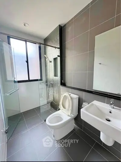 Modern bathroom with sleek design and glass shower enclosure