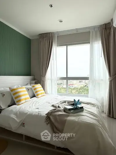 Bright and cozy bedroom with large window and stylish decor