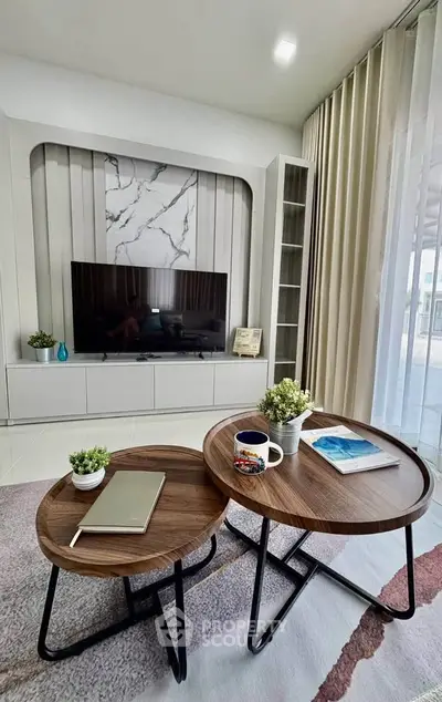 Modern living room with stylish TV unit and elegant decor