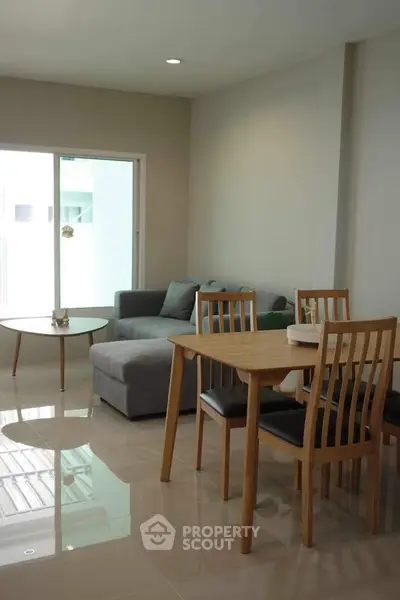 Modern living room with sleek furniture and natural light