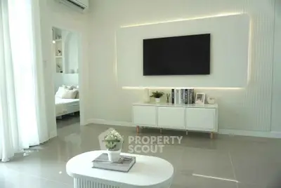 Modern living room with sleek TV setup and elegant decor