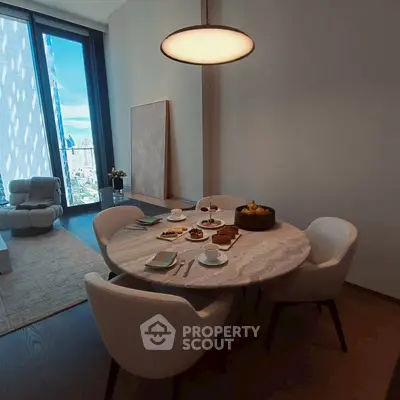 Luxurious dining area with city view, modern furniture, and elegant decor in high-rise apartment.
