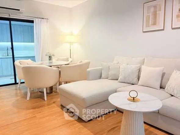 Elegant living room with modern furniture and open layout, perfect for stylish urban living.