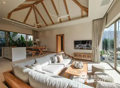 Luxurious living room with high ceilings and modern decor in a spacious open-plan layout