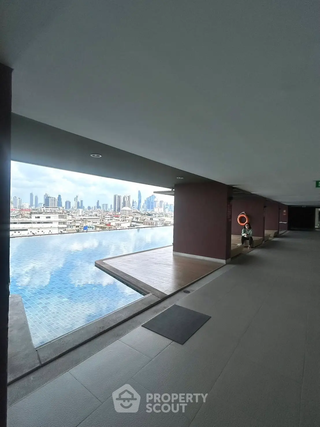 Stunning rooftop pool with panoramic city skyline views, perfect for luxury urban living.