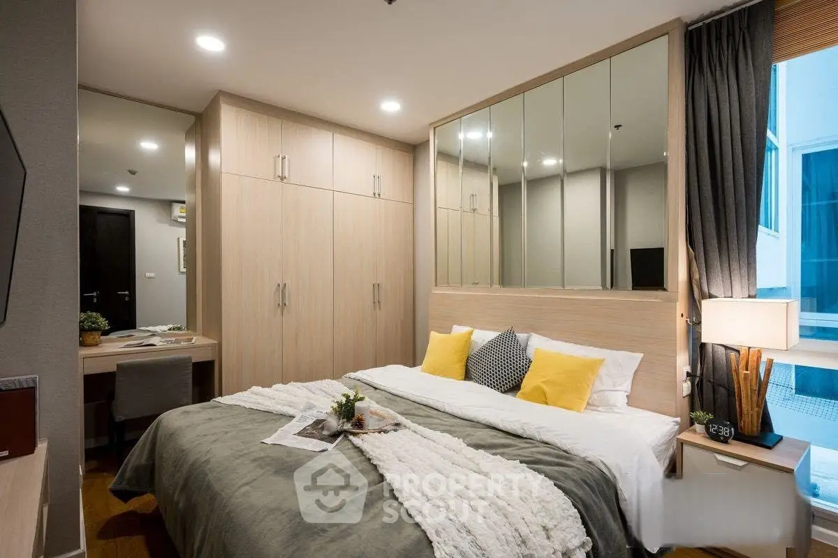 Modern bedroom with stylish decor and ample storage space