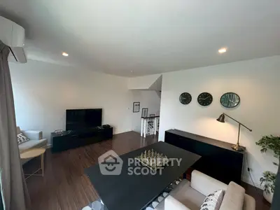 Spacious modern living room with stylish decor and hardwood floors