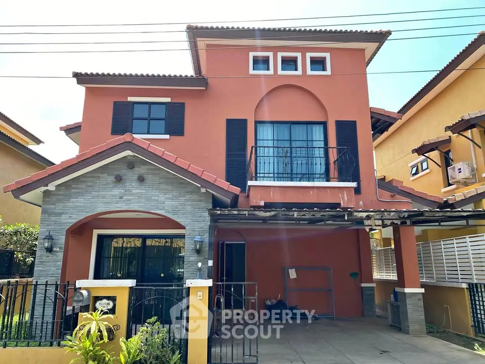 Charming two-story house with unique architectural design and spacious driveway in a serene neighborhood.