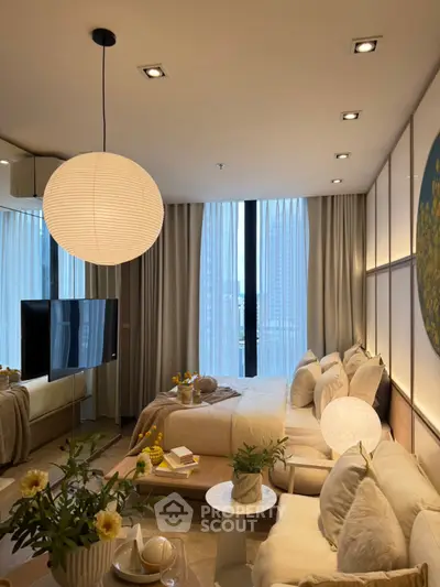 Luxurious modern bedroom with elegant decor and large windows offering stunning city views.