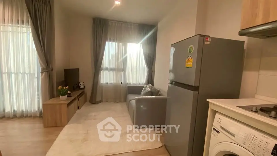 Cozy living room with modern appliances and natural light