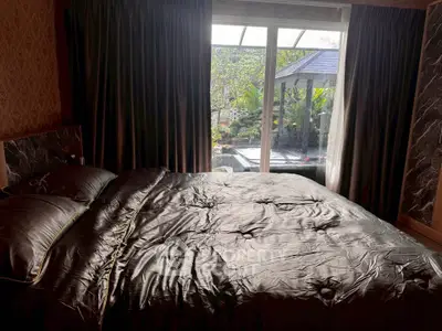 Luxurious bedroom with garden view and elegant decor