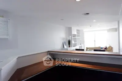 Spacious open-plan living area with modern design and ample natural light.