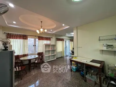 Spacious dining area with elegant ceiling design and ample natural light